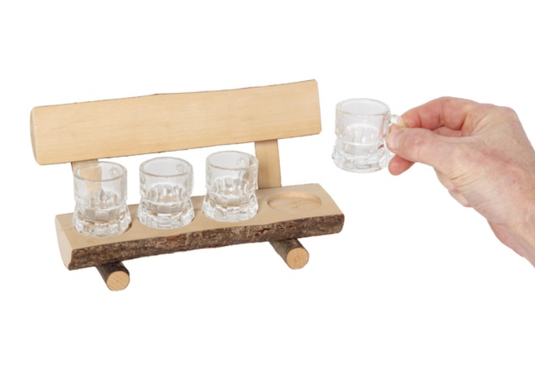 Bench made of massive wood with four shot glasses